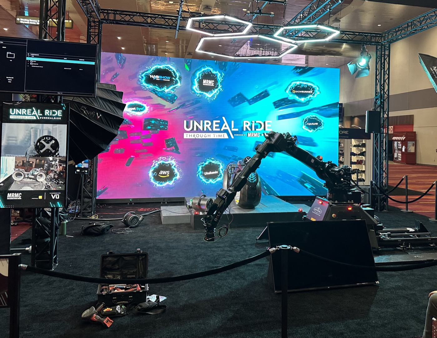 The Unreal Ride installation at NAB 2023 — LED wall, robot arm, and camera rig on an empty stage.